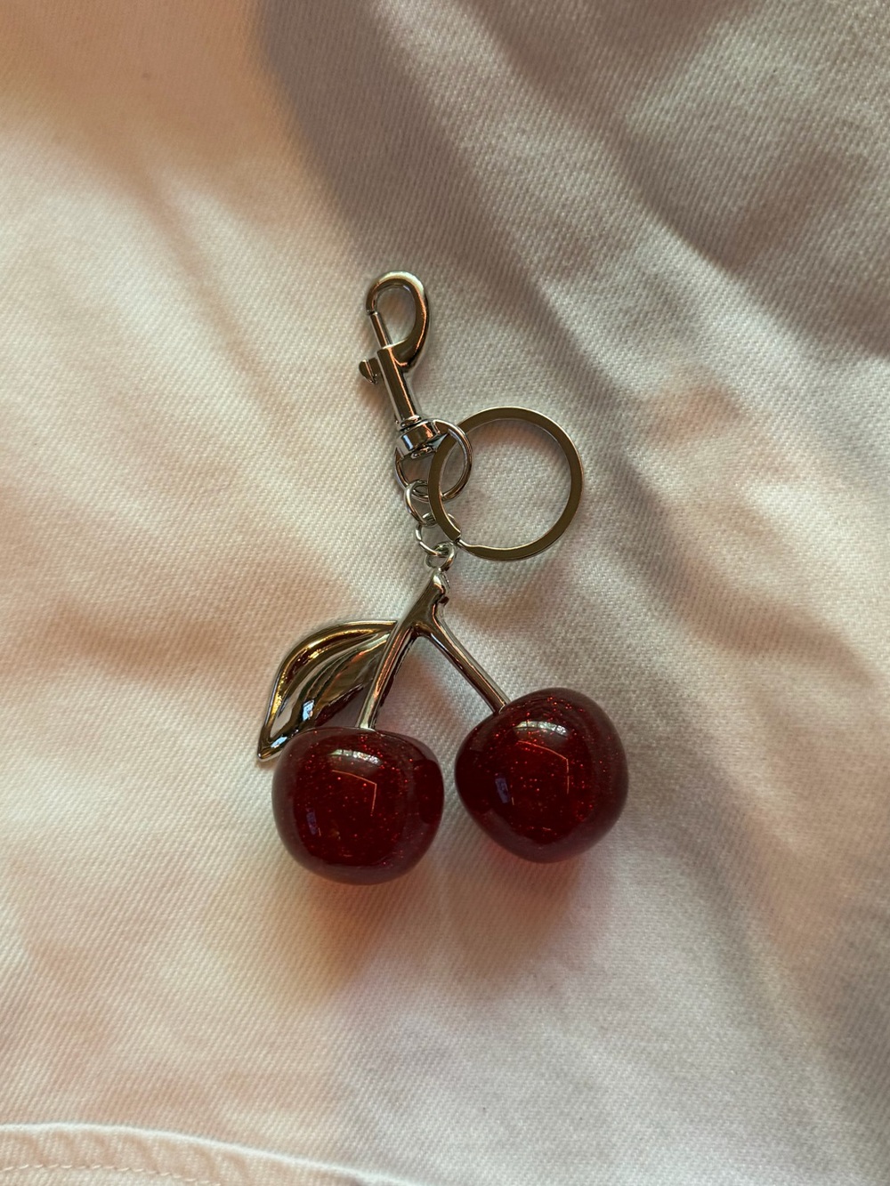 red and silver cherry keychain